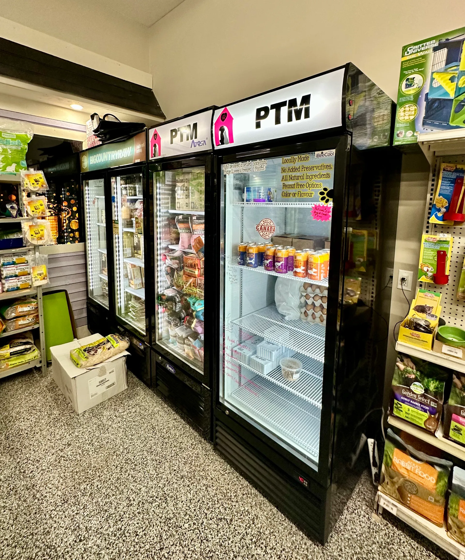 Refrigerated pet foods display at PTM Pet Supplies